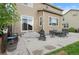Concrete patio area featuring outdoor furniture, grill, landscaping, and access to the home at 5161 Chicory Cir, Brighton, CO 80601