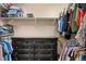 Spacious walk-in closet with installed shelving and ample storage and hanging space at 5161 Chicory Cir, Brighton, CO 80601
