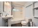 Classic bathroom design featuring a pedestal sink, subway tile shower, and slate flooring at 233 N 10Th Ave, Brighton, CO 80601