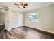 Bedroom featuring hardwood floors, closet and an exterior window that brings in natural light at 233 N 10Th Ave, Brighton, CO 80601