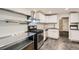 Well-lit kitchen featuring stainless steel appliances, white cabinetry, and sleek countertops at 233 N 10Th Ave, Brighton, CO 80601