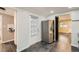 Well-lit kitchen featuring stainless steel appliances, an exterior door, and tiled floors for added convenience at 233 N 10Th Ave, Brighton, CO 80601