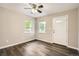 Bright living room with a view from two windows, complemented by modern flooring and neutral walls at 233 N 10Th Ave, Brighton, CO 80601