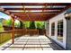 Relaxing back deck with wooden pergola, outdoor lighting, and access to the back yard at 4894 E Ashton Ave, Castle Rock, CO 80104