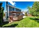 View of backyard featuring a wooden deck with pergola and green lawn at 4894 E Ashton Ave, Castle Rock, CO 80104