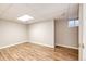 Unfinished basement featuring wood-look floors, recessed lighting, and a single window at 4894 E Ashton Ave, Castle Rock, CO 80104