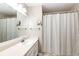 Bright bathroom featuring a shower-tub, white vanity and a large mirror at 4894 E Ashton Ave, Castle Rock, CO 80104