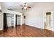 Large bedroom with hardwood floors, ceiling fan, and ensuite bathroom at 4894 E Ashton Ave, Castle Rock, CO 80104