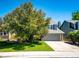 Two-story home with attached garage, well-maintained lawn and landscaping at 4894 E Ashton Ave, Castle Rock, CO 80104