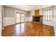 Cozy living room with hardwood floors, brick fireplace, and french doors at 4894 E Ashton Ave, Castle Rock, CO 80104