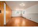 Finished basement featuring hardwood floors, wainscoting and two windows at 588 Newark St, Aurora, CO 80010