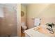 Bathroom with pink tiles, shower, and a sink with a marble countertop at 588 Newark St, Aurora, CO 80010