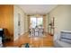Inviting dining area featuring natural light, a chandelier, and hardwood flooring at 588 Newark St, Aurora, CO 80010