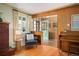 Cozy living room with a brick fireplace, hardwood floors, and a charming interior design at 588 Newark St, Aurora, CO 80010
