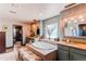 Serene bathroom features a soaking tub, dual vanities, and a walk-in closet for a spa-like experience at 25338 E Costilla Pl, Aurora, CO 80016