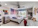 Youthful bedroom with a window view, fun decor, and cozy furnishings for a personalized space at 25338 E Costilla Pl, Aurora, CO 80016