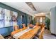 Sophisticated dining room with decorative chandelier, perfect for elegant gatherings at 25338 E Costilla Pl, Aurora, CO 80016
