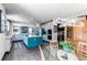 Bright, modern kitchen with a large center island, stainless appliances, and an open layout leading to the dining area at 25338 E Costilla Pl, Aurora, CO 80016