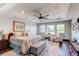 Spacious main bedroom suite with tray ceiling, large windows, and elegant furnishings for a luxurious retreat at 25338 E Costilla Pl, Aurora, CO 80016