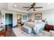 Relaxing main bedroom showcasing a sitting area and ensuite bathroom for ultimate convenience at 25338 E Costilla Pl, Aurora, CO 80016
