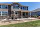 Back patio offers ample seating for outdoor relaxation and entertaining guests at 25338 E Costilla Pl, Aurora, CO 80016