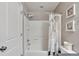 Simple bathroom featuring shower-tub combo, patterned shower curtain, and vanity at 10639 Worchester Dr, Commerce City, CO 80022