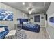 Stylish bedroom featuring a blue velvet bed with eye-catching patterns and decor at 10639 Worchester Dr, Commerce City, CO 80022