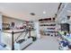 Custom walk-in closet with organized shelves and ample storage, designed for the ultimate fashion enthusiast at 10639 Worchester Dr, Commerce City, CO 80022