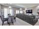 Open living space featuring a dining area, comfortable seating, and modern entertainment setup, great for Gathering gatherings at 10639 Worchester Dr, Commerce City, CO 80022
