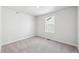 Cozy bedroom with plush carpeting and a window offering ample natural light at 2161 Flower Blossom Ave, Brighton, CO 80601