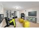 Finished basement with workout equipment, a TV, and unique storage solutions at 618 Milwaukee St, Denver, CO 80206