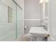 Bathroom featuring glass shower doors and a classic pedestal sink at 618 Milwaukee St, Denver, CO 80206