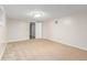 Bright bedroom featuring neutral carpeting, a modern light fixture and a walk-in closet at 618 Milwaukee St, Denver, CO 80206