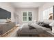Serene bedroom with a large window, stylish dresser, and modern decor at 618 Milwaukee St, Denver, CO 80206