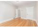 Neutral bedroom offers hardwood floors, white trim, and closet at 618 Milwaukee St, Denver, CO 80206