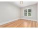 Bright bedroom with hardwood floors, light walls, and natural light at 618 Milwaukee St, Denver, CO 80206