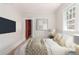 Comfortable bedroom featuring a TV, stylish decor, and a large window for natural light at 618 Milwaukee St, Denver, CO 80206
