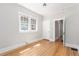 Bedroom with hardwood floors and natural light from two windows at 618 Milwaukee St, Denver, CO 80206