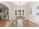 Cozy dining room with hardwood floors, large windows, and modern chandelier at 618 Milwaukee St, Denver, CO 80206