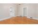 Open dining room features access to kitchen, hardwood floors, and neutral paint at 618 Milwaukee St, Denver, CO 80206