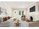 Bright living room features a fireplace, hardwood floors, and an abundance of natural light at 618 Milwaukee St, Denver, CO 80206