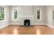 Bright living room features hardwood floors and ample windows for natural light at 618 Milwaukee St, Denver, CO 80206