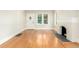 Living room features a fireplace, hardwood floors, and an abundance of natural light at 618 Milwaukee St, Denver, CO 80206