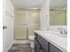 Clean bathroom with a shower/tub combo and gray vanity at 2725 W 86Th Ave # 5, Westminster, CO 80031