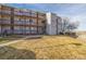 Exterior of a two-story condo building with balconies and grassy area at 2725 W 86Th Ave # 5, Westminster, CO 80031