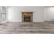 Stone fireplace in a living room with wood-look floors at 2725 W 86Th Ave # 5, Westminster, CO 80031