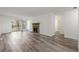 Living room featuring wood-look floors, fireplace, and access to balcony at 2725 W 86Th Ave # 5, Westminster, CO 80031