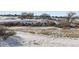 Aerial view of homes and neighborhood with snow at 11701 Bent Oaks St, Parker, CO 80138