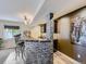 Basement bar with stone feature wall and seating at 11701 Bent Oaks St, Parker, CO 80138