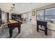 Game room with shuffleboard, foosball, and seating area at 11701 Bent Oaks St, Parker, CO 80138